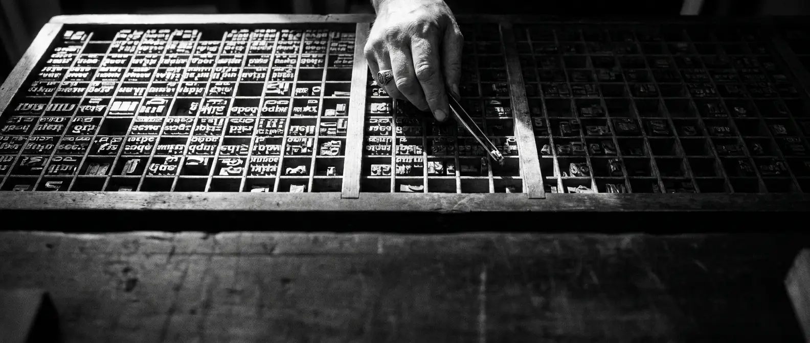Letterpress type case of metal letters in a precise grid, representing structured AI-ready website content