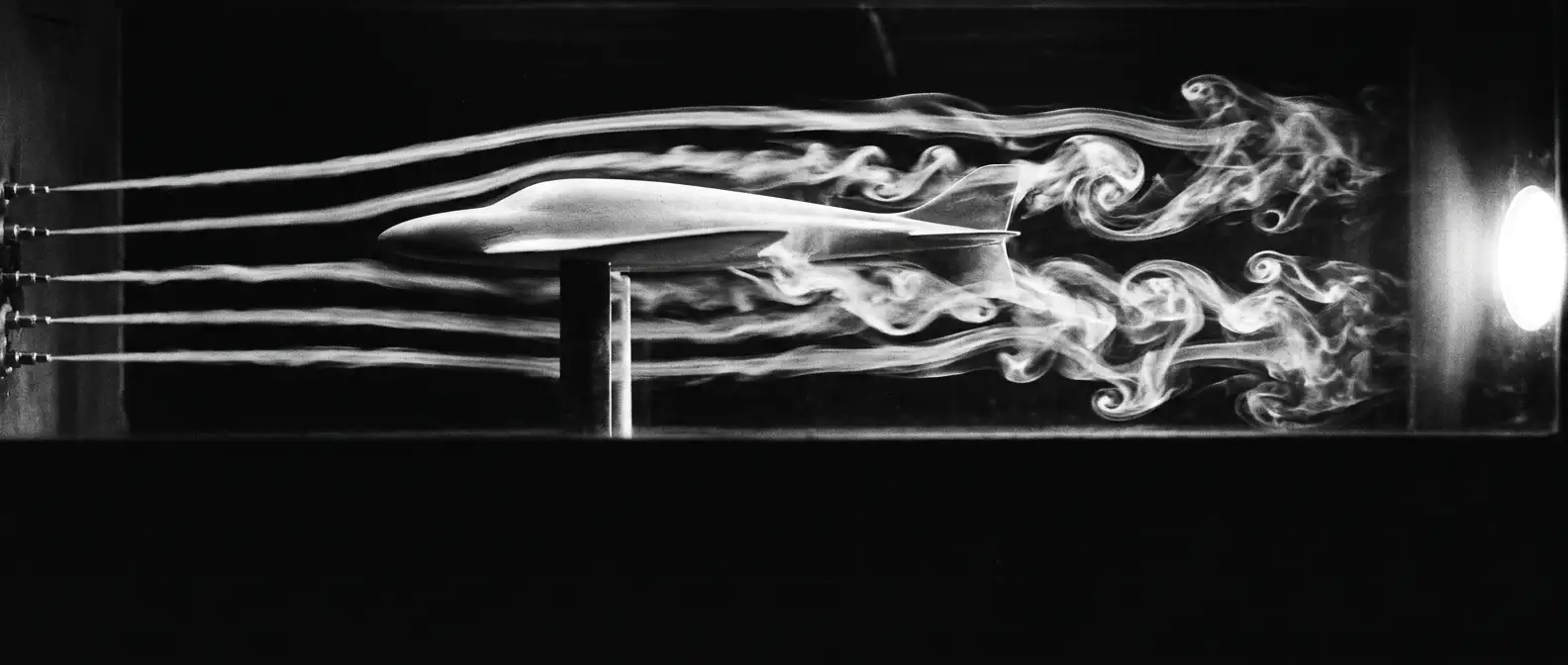 Smoke streamlines flowing through a wind tunnel, representing structured AI search testing