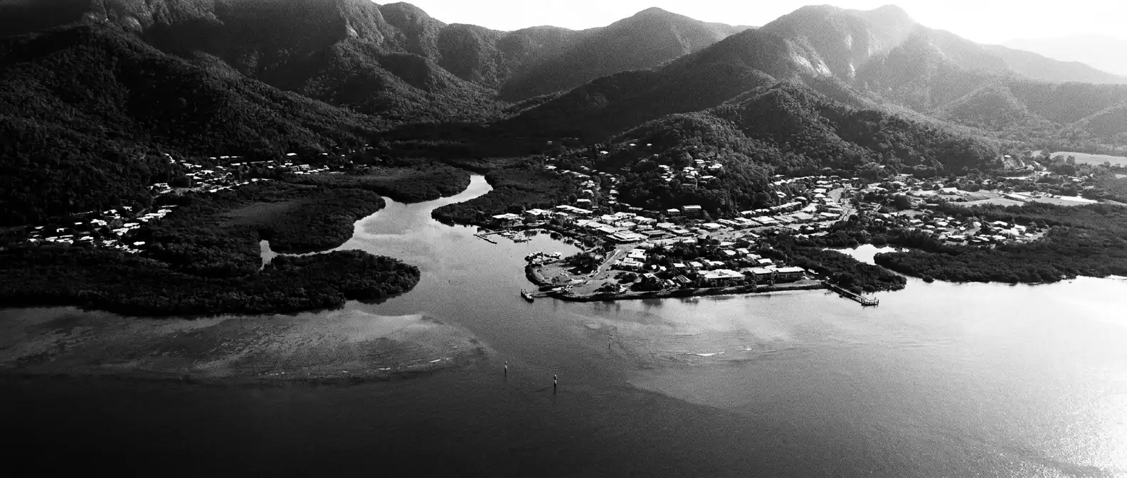 Aerial view of the Cairns inlet with rainforest ranges behind, representing AI search visibility for Cairns businesses