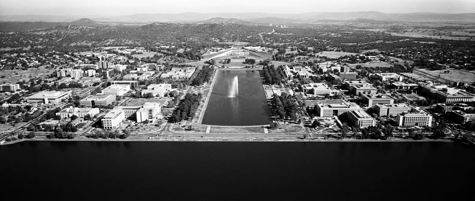 Aerial view of Lake Burley Griffin and Canberra radial avenues, representing AI search visibility for Canberra businesses