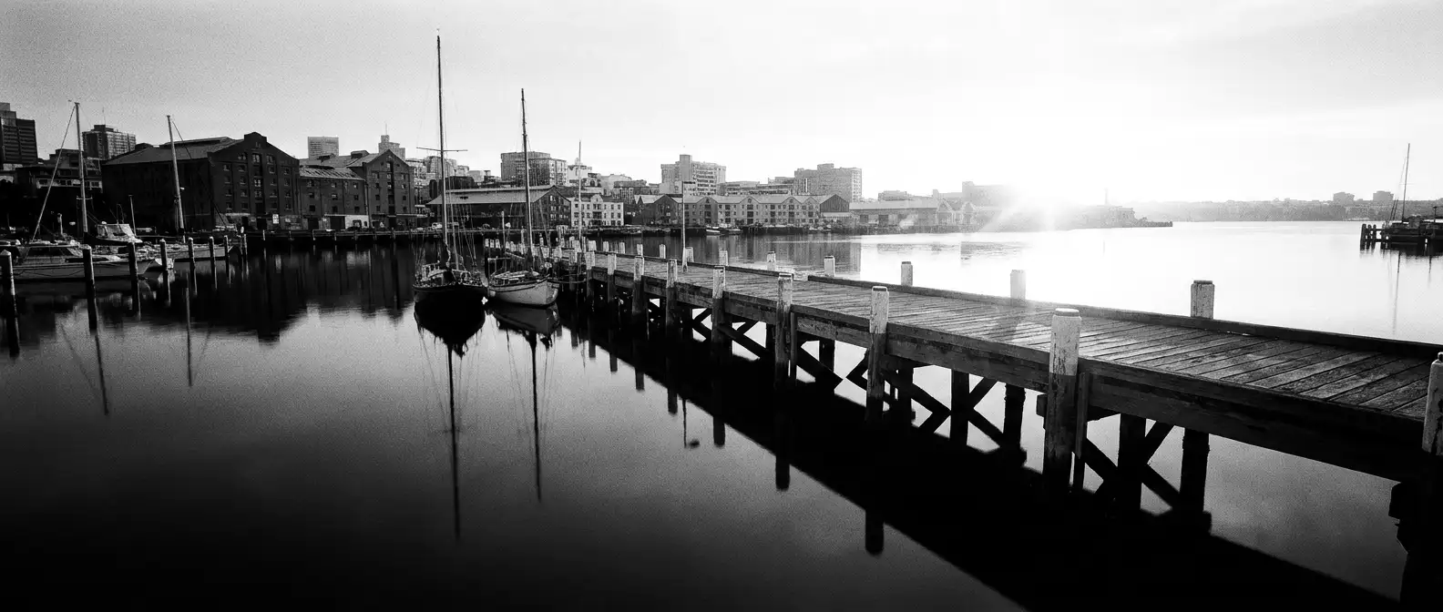 A long timber pier reaching into Corio Bay at dawn, representing AI search visibility for Geelong businesses