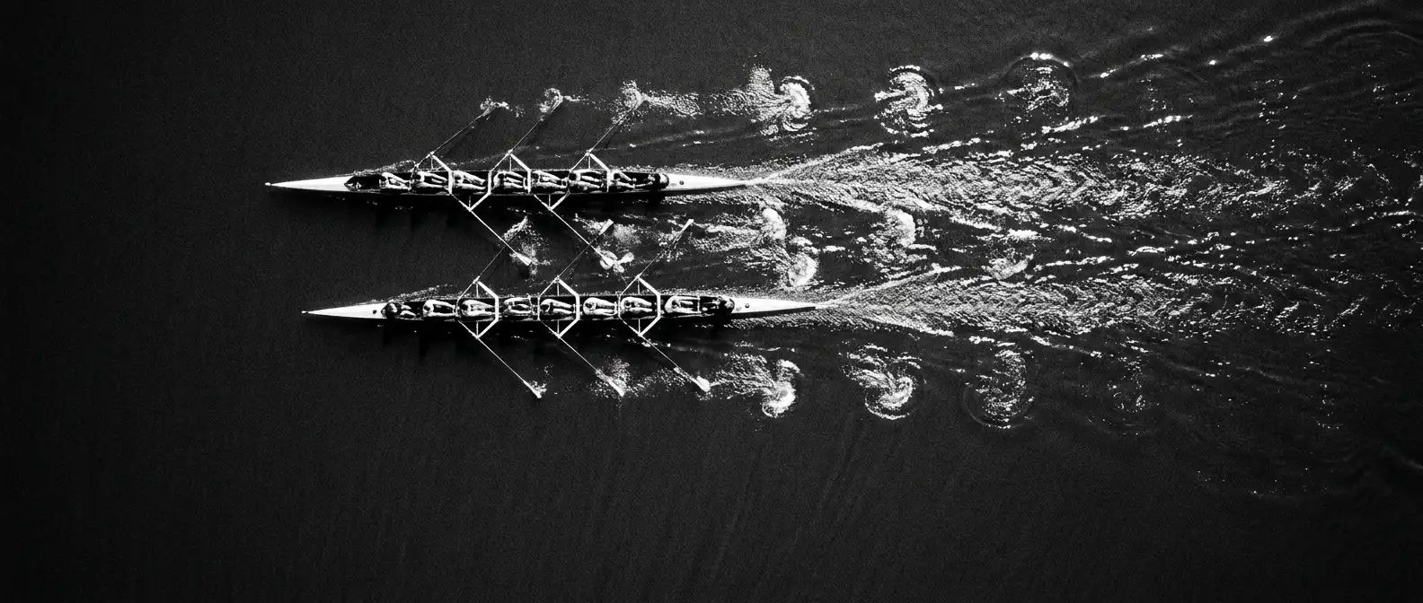 Overhead view of two rowing eights racing side by side, representing competitor visibility analysis