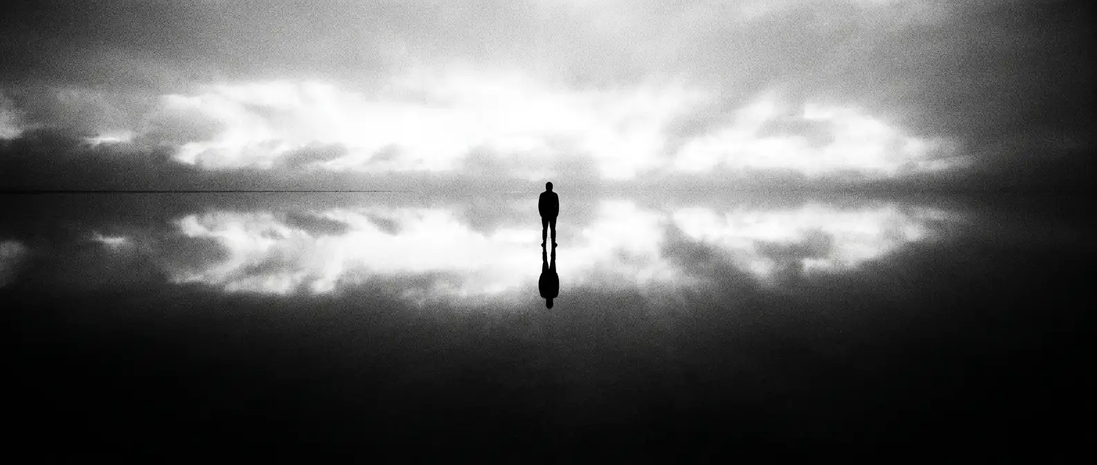 Figure mirrored perfectly in a glass-still salt lake at dawn, representing reputation and review optimisation